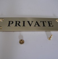 Brass plaque with dome fixings