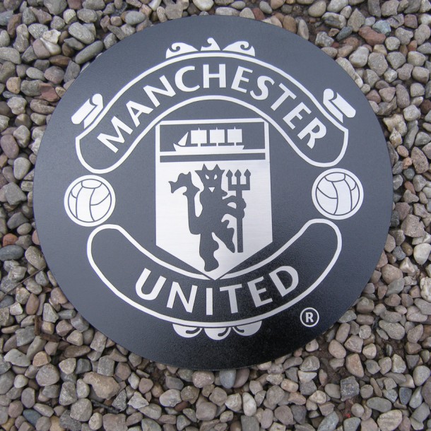 Reverse etched and filled black stainless steel