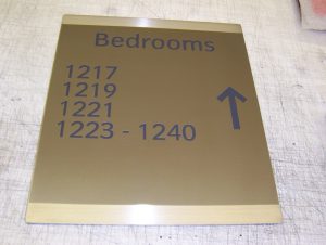 One of 2,000 shaded brass hotel signs