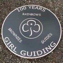 Bronze reverse engraved, and backfilled black. 3 mm thick x 75 cm in diamater with studs and template on the rear