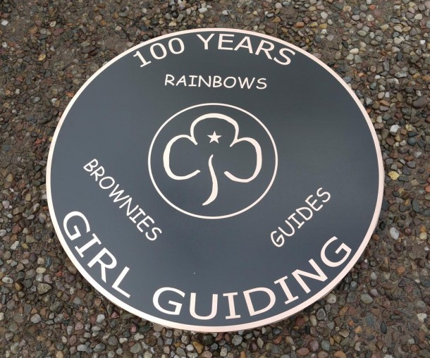 Bronze reverse engraved, and backfilled black. 3 mm thick x 75 cm in diamater with studs and template on the rear