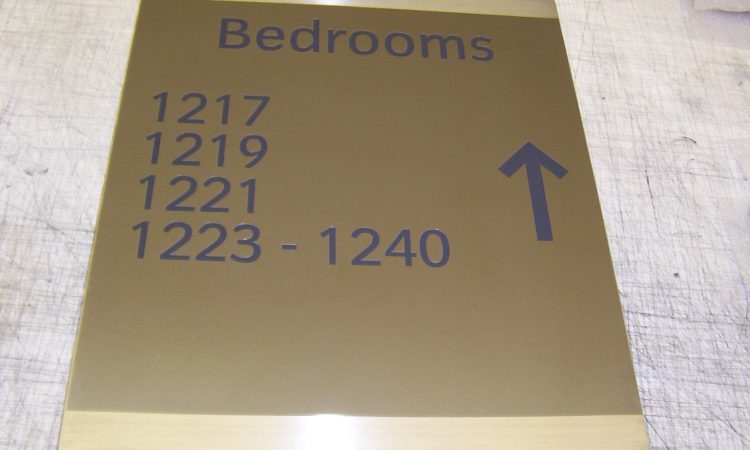 One of 2,000 shaded brass hotel signs