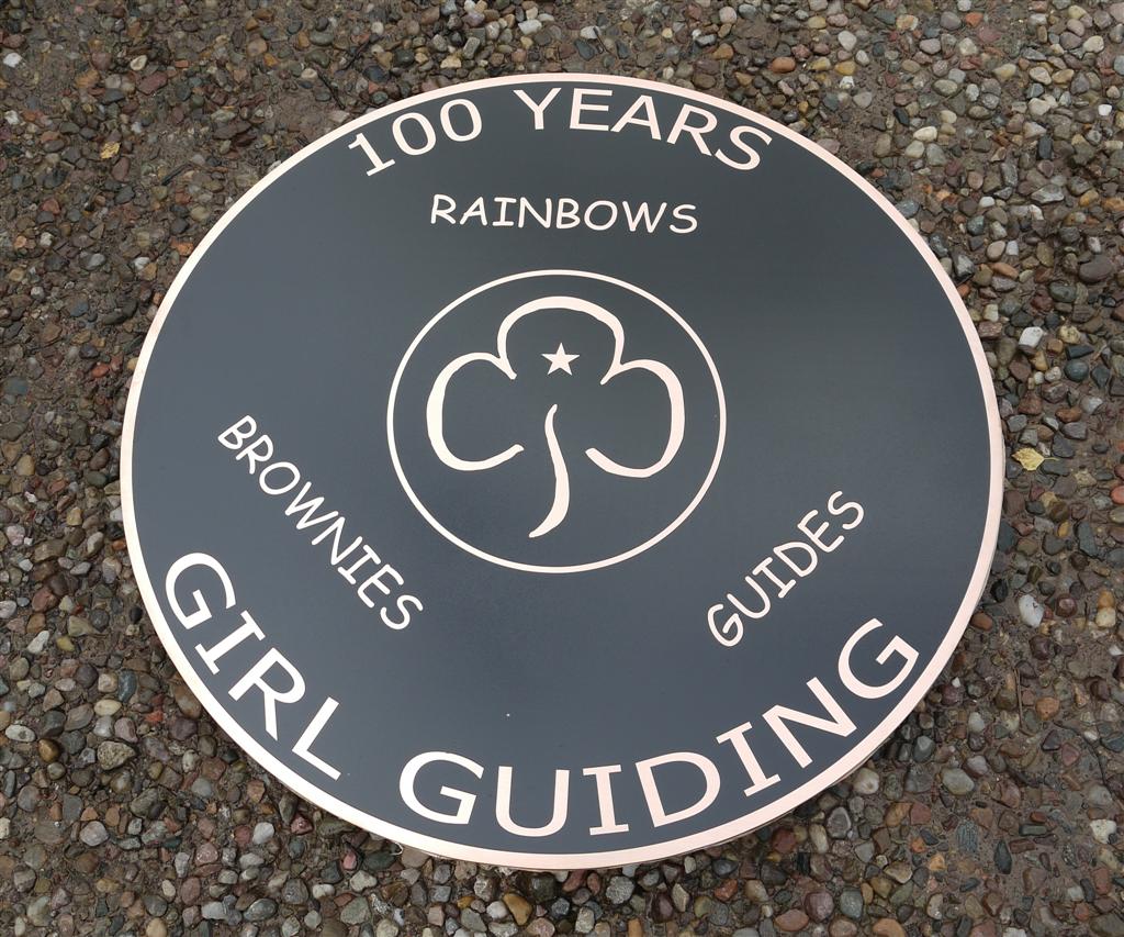 Bronze reverse engraved, and backfilled black. 3 mm thick x 75 cm in diamater with studs and template on the rear