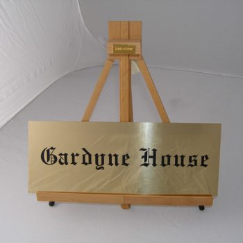 brass house sign